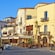 Houses and cafés along a waterfront promenade in Chania, Greece